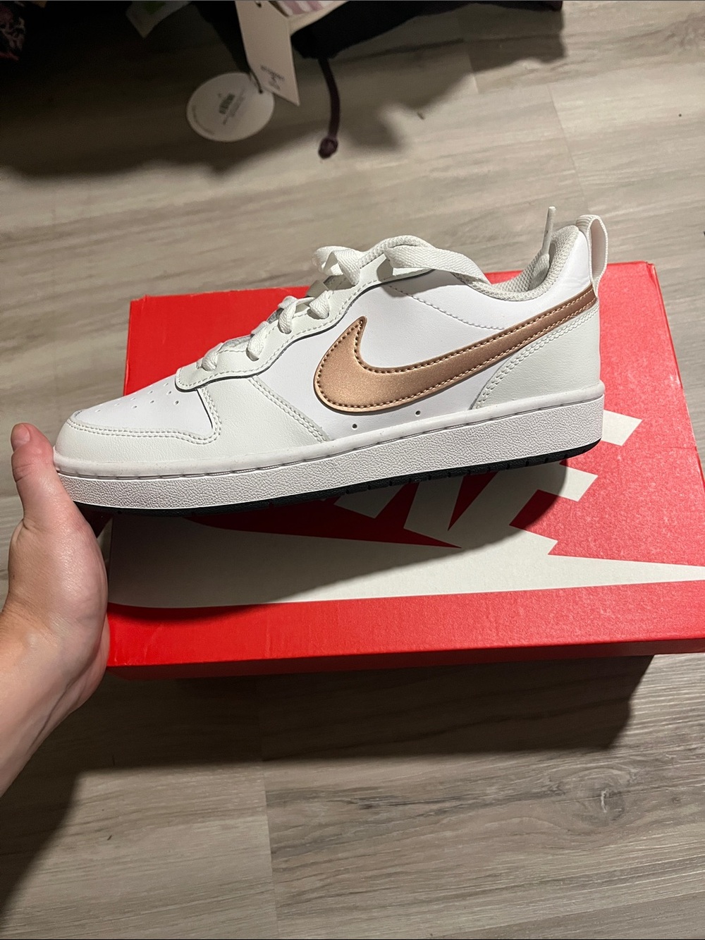 Nike Women's White Sneakers with Metallic Rose Swoosh